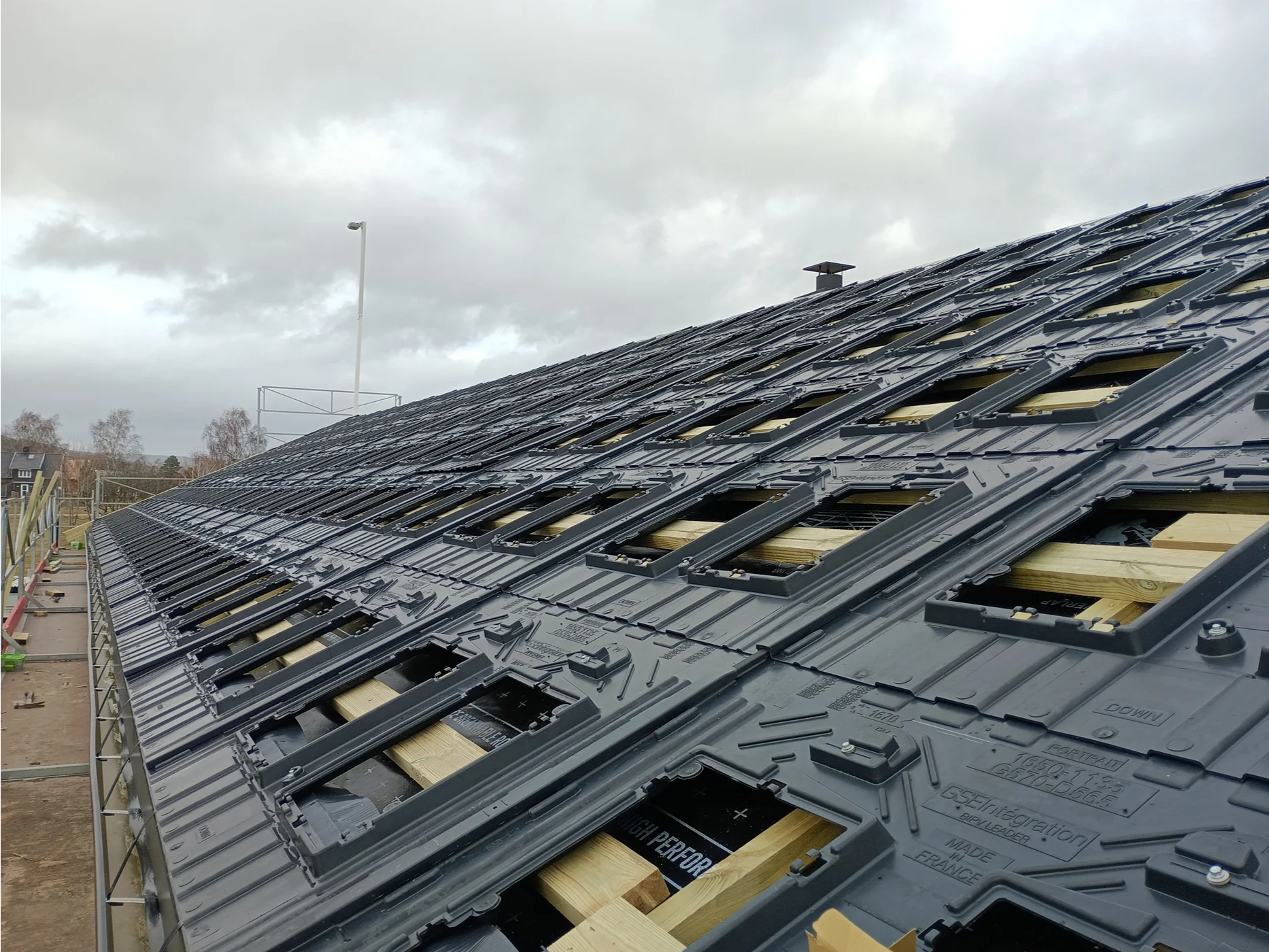 Metal roof with skylights during installation work