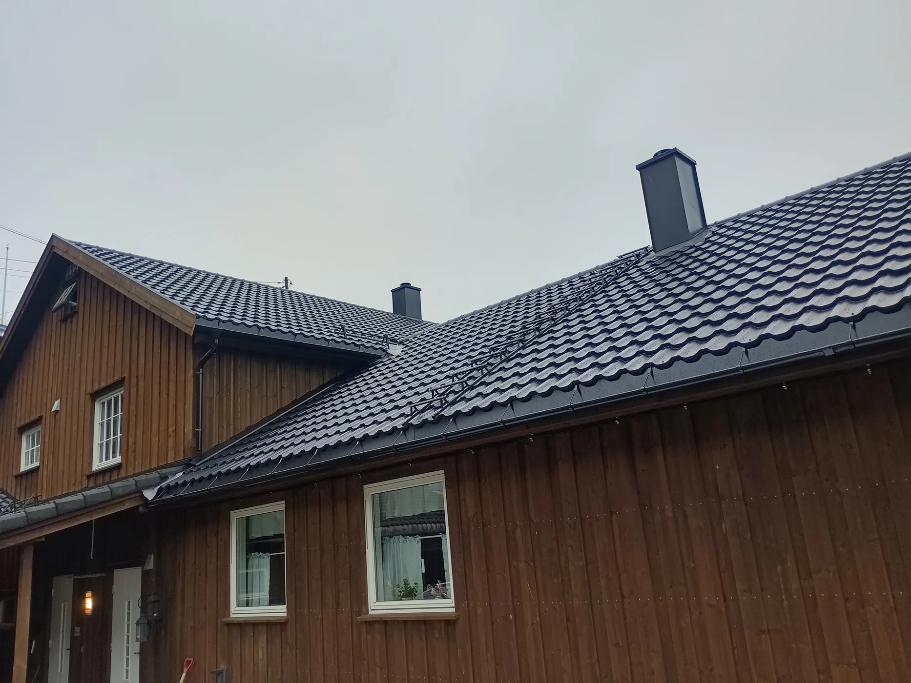 Contemporary wooden house with metal roof