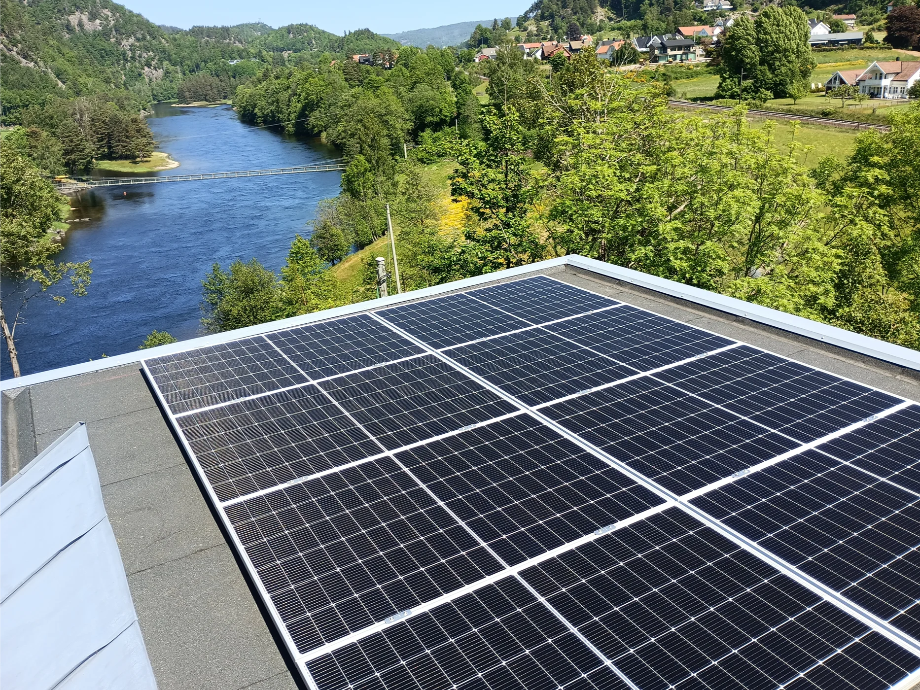 Solar panels installation overlooking river valley